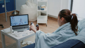 Sick patient talking to doctor on video call for telehealth